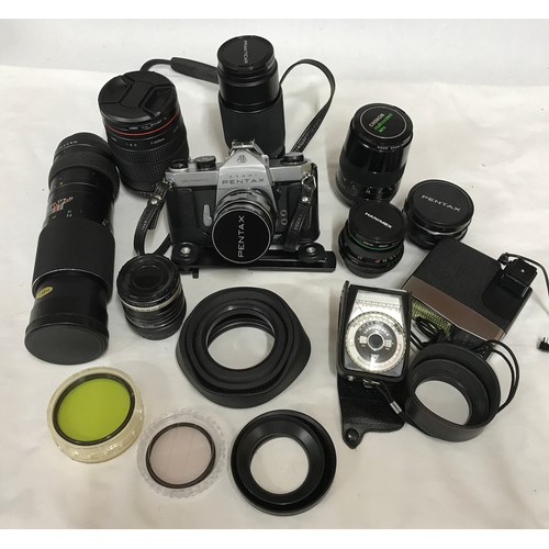 888 - A camera bag and accessories to include an Asahi Pentax SP Spotmatic camera, a mirror lens 500mm, Op... 