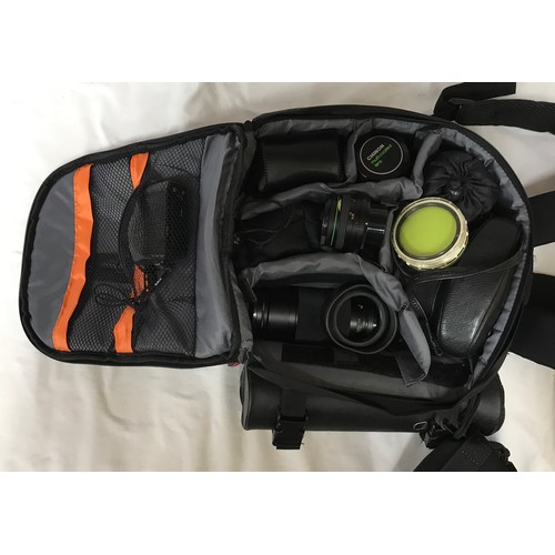 888 - A camera bag and accessories to include an Asahi Pentax SP Spotmatic camera, a mirror lens 500mm, Op... 