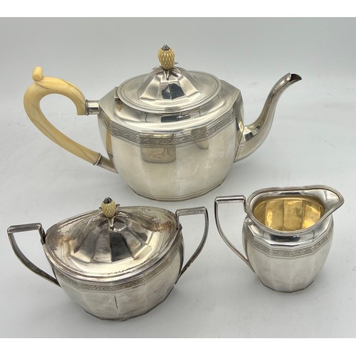 752 - A three piece silver tea service with ivory pineapple shaped knop to teapot and sugar bowl, Birmingh... 