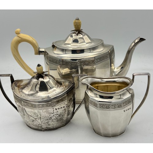 752 - A three piece silver tea service with ivory pineapple shaped knop to teapot and sugar bowl, Birmingh... 