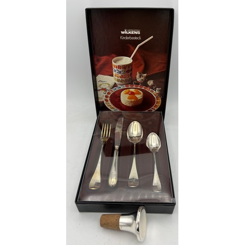 755 - A Wilkens German silver Christening set in original box together with a .925 silver bottle stopper.