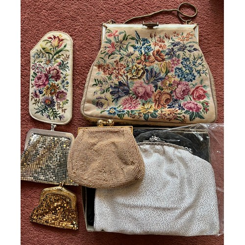 877 - Two vintage evening bags, three purses and a spectacle case. Largest bag 17 x21cm.