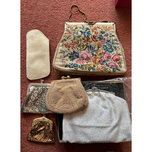 877 - Two vintage evening bags, three purses and a spectacle case. Largest bag 17 x21cm.