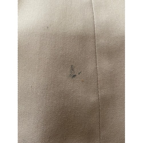 878 - Burberry - A gents khaki single breasted rain mac with tartan lining. Approx armpit to armpit 64cm/2... 