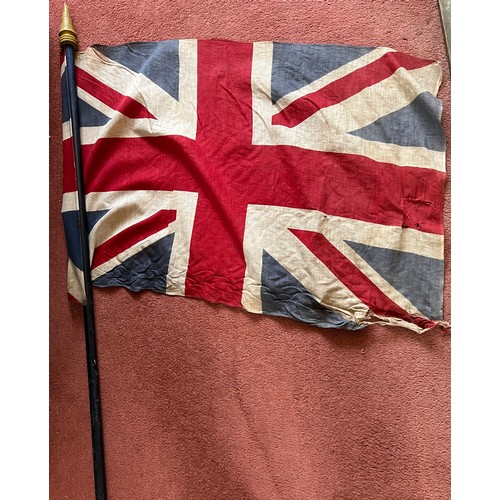 960 - A vintage Union Jack on wooden pole. 163cm high.