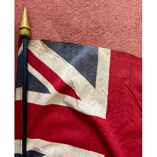 960 - A vintage Union Jack on wooden pole. 163cm high.