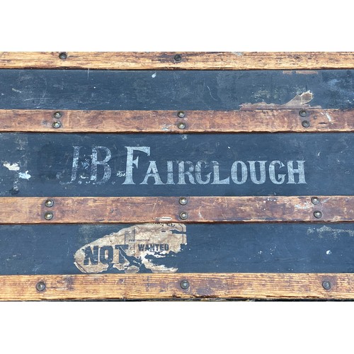 962 - An early 20thC wood and metal bound steamer trunk belonging to J.B.Fairclough, with carry handle to ... 