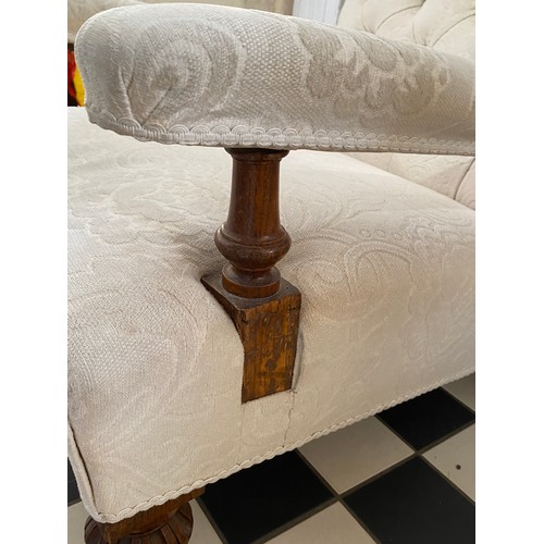 62 - A late 19thC button back chair with oak legs and supports and ceramic castors.