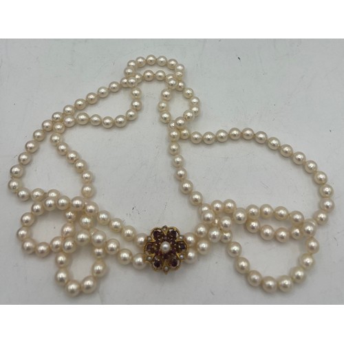 484 - A single strand cultured pearl necklace 114 cm l with 9 carat gold clasp 7.8gm set with pearls and r... 