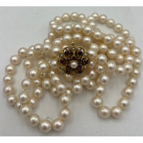 484 - A single strand cultured pearl necklace 114 cm l with 9 carat gold clasp 7.8gm set with pearls and r... 