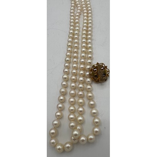 484 - A single strand cultured pearl necklace 114 cm l with 9 carat gold clasp 7.8gm set with pearls and r... 