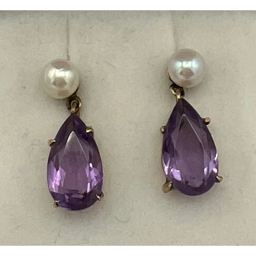 491 - Amethyst and cultured pearl earrings set in 9 carat gold.