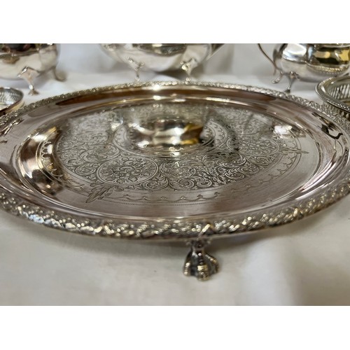 677 - A quantity of silver plate including 2 x galleried trays, a raised salver, a tea and coffee set by G... 