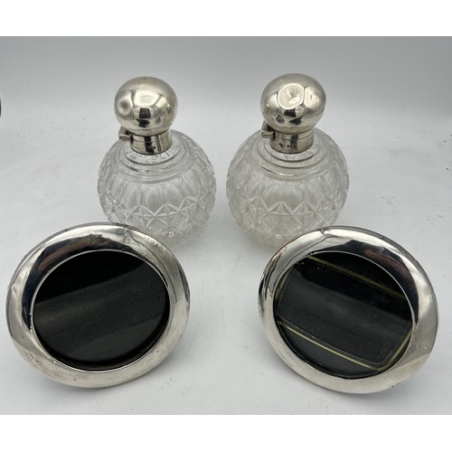 764 - Silver items to include a pair of scent bottles William Hutton & Sons Ltd, London 1895 and pair of p... 