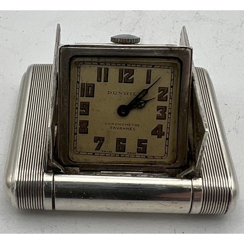 770 - An Art Deco Dunhill silver miniature travel clock, engine turned case with hinged divided doors encl... 