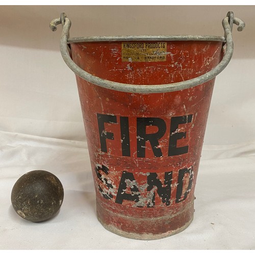 967 - A red metal Fire/Sand bucket from Kingsford Products Ltd 32cm to rim, a cannon ball and two cast iro... 