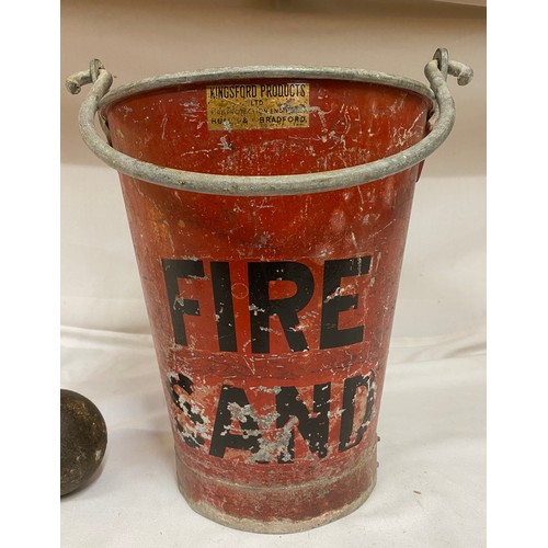 967 - A red metal Fire/Sand bucket from Kingsford Products Ltd 32cm to rim, a cannon ball and two cast iro... 