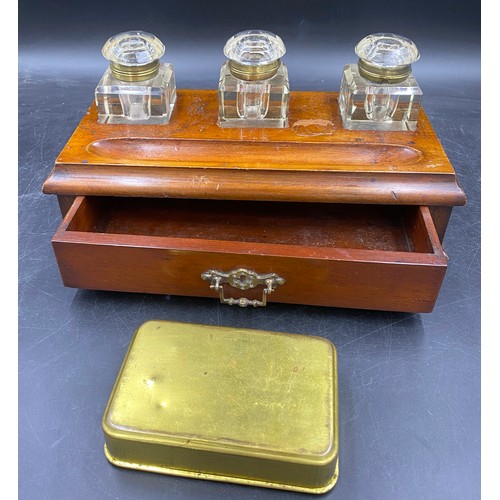 972 - A mahogany inkstand with drawer and three glass bottles with brass hinges etched to top, Copy G, Red... 