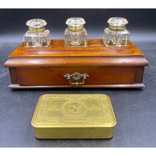 972 - A mahogany inkstand with drawer and three glass bottles with brass hinges etched to top, Copy G, Red... 