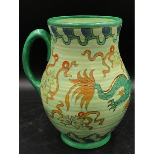 148 - A Charlotte Rhead green vase for Crown Ducal with ribbed shape, Manchu dragon pattern and single han... 