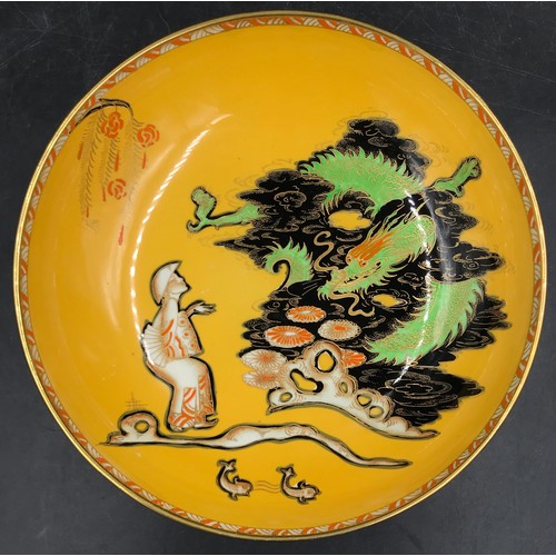 150 - Carlton Ware fruit bowl on three gilt raised feet with unusual Dragon and Traveller pattern in colou... 