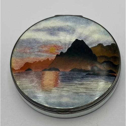 774 - A Norwegian silver and enamel compact by Kristen Hestenes depicting mountains and sea, marked .925 K... 