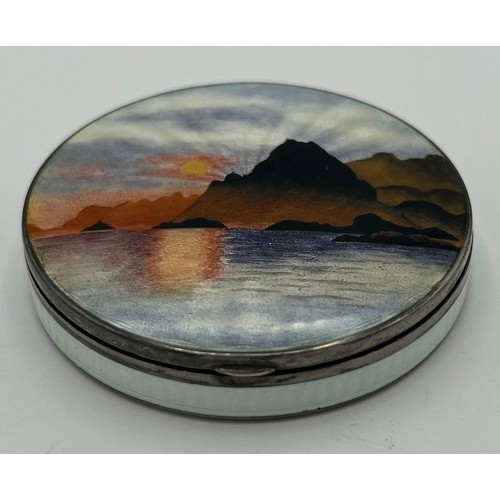 774 - A Norwegian silver and enamel compact by Kristen Hestenes depicting mountains and sea, marked .925 K... 