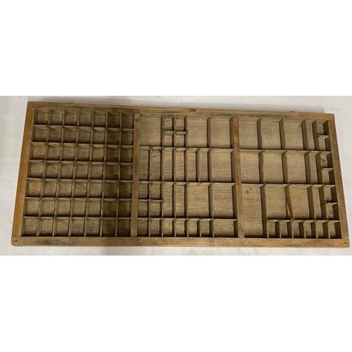 971 - A Wooden tray compartmentalised to take Printers' lettering 83cm x 37cm.