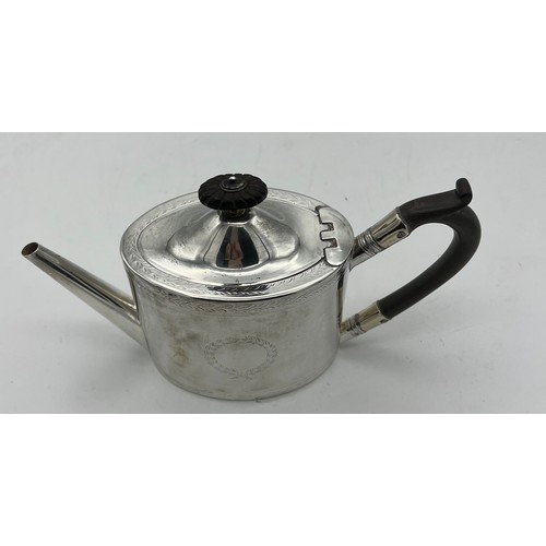 761 - A Victorian silver bachelor's teapot with ebony handle and knop. London 1871, maker Henry Holland. H... 