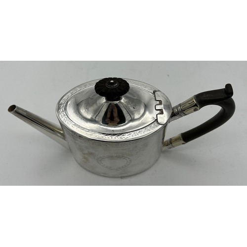 761 - A Victorian silver bachelor's teapot with ebony handle and knop. London 1871, maker Henry Holland. H... 