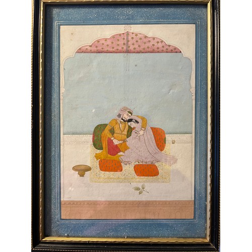 1182 - A good quality framed Mughal watercolour depicting a couple embracing. 21cm x 15cm.