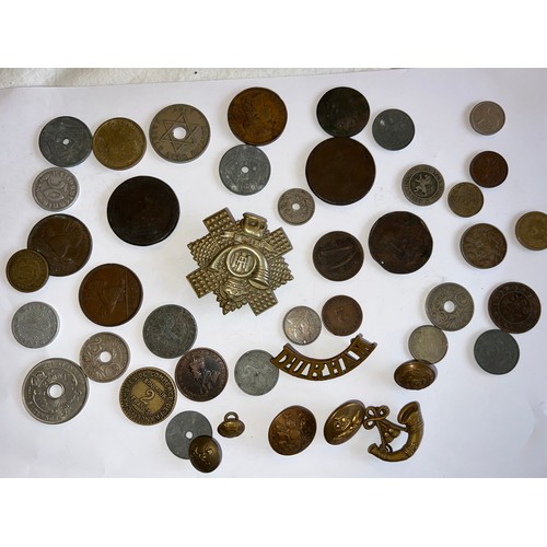 558 - Coins and military badges to include Durham badge, Francs etc.