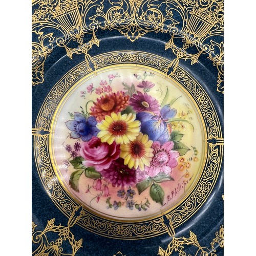 157 - A Royal Worcester cabinet plate decorated by E. Phillips. 23.5cm d.