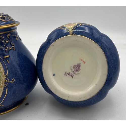 162 - A pair of Royal Worcester pot pourri jars and covers by W. Bee with date mark for 1923. 16cm high.