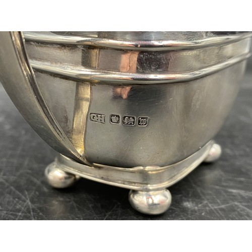 780 - A silver jug on bun feet hallmarked Sheffield 1904 Harrison Brothers & Howson. Total weight 167gms 9... 