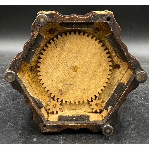 973 - A musical box/sewing companion, hexagonally shaped with ebonised, gilt and shell embellishments on r... 