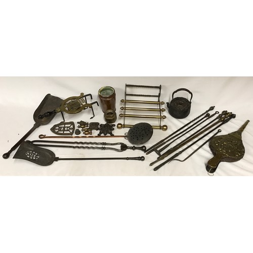 822 - A collection of brass and copper to include mainly fireplace wares: fire irons, tongs, shovels and b... 