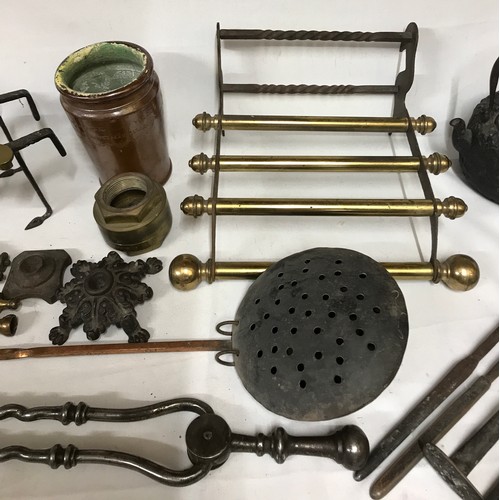 822 - A collection of brass and copper to include mainly fireplace wares: fire irons, tongs, shovels and b... 