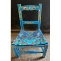 A painted child's chair with rushed seat. 22 h to seat, 47cm h to back.