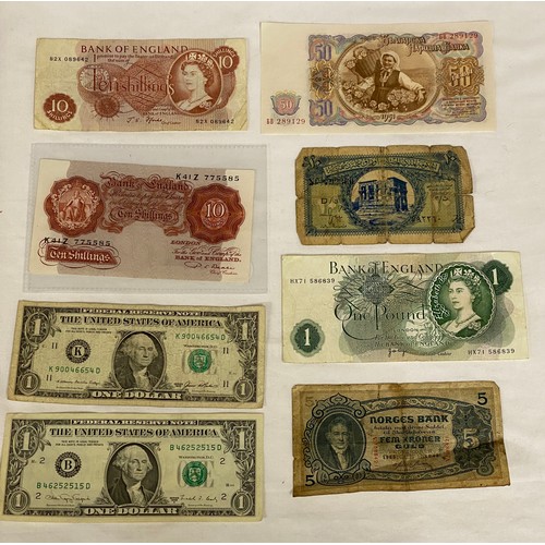 557 - Two ten shilling notes, a one pound note, two U.S. one dollar bills, a 1951 Bulgarian 50 Leva note, ... 