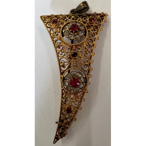 411A - An Indian brooch/pendant, 6cm long, tests as approx. 15ct gold with rubies and rose cut diamonds. We... 