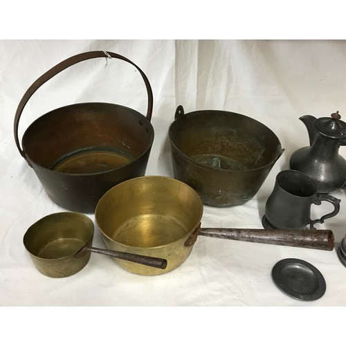 1001 - A collection of brass, copper and pewter to include two copper pans, two brass buckets and pewter co... 