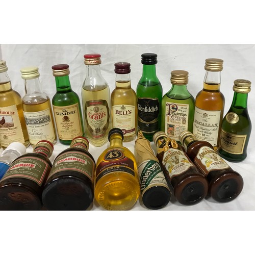 698 - Assorted miniatures to include: Whisky (11) Grants (3) Macallan (1) and Liqueur, Rum etc  - approx 5... 