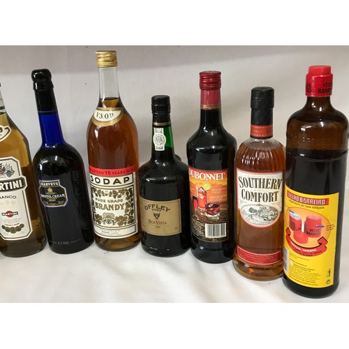 700 - Eleven assorted bottles of spirits to include Southern Comfort, Martini (3), Drambuie, Dubonnet, Por... 