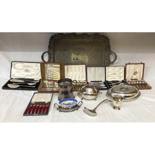 767 - A collection of silver plate items to include a large ornate serving tray on raised feet 74.5 x 46cm... 