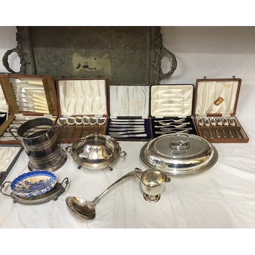 767 - A collection of silver plate items to include a large ornate serving tray on raised feet 74.5 x 46cm... 