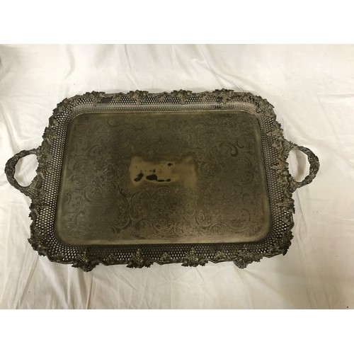 767 - A collection of silver plate items to include a large ornate serving tray on raised feet 74.5 x 46cm... 