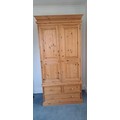A pine wardrobe 202cm h x 102 w x 58 d.