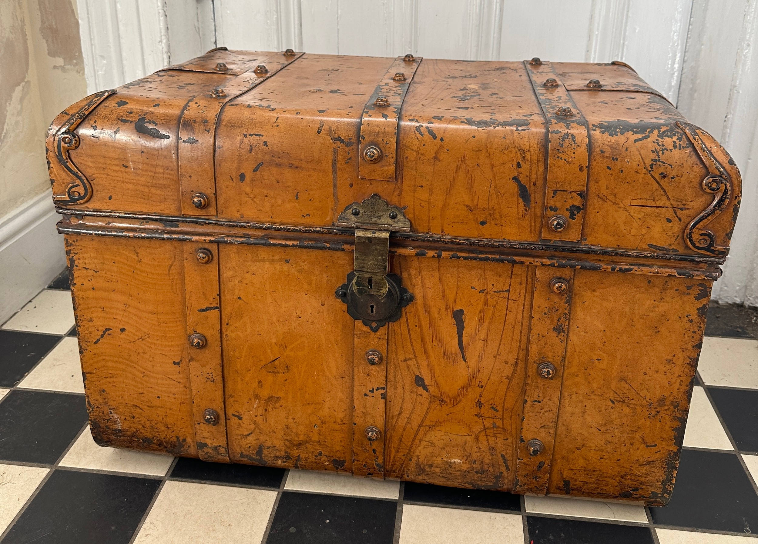 A vintage metal travel trunk with side handles. 71 w x 48