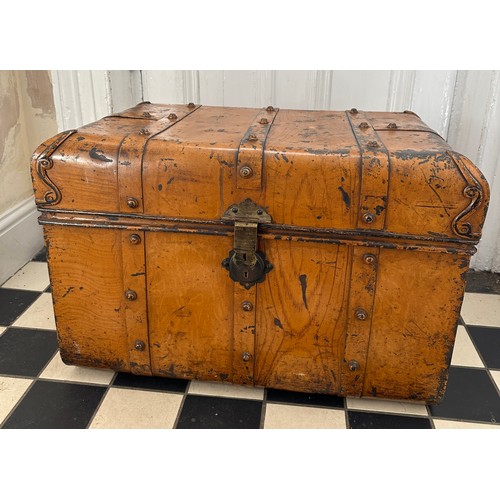 A vintage metal travel trunk with side handles. 71 w x 48